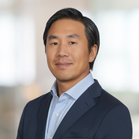 Professional headshot of Christopher Nam.